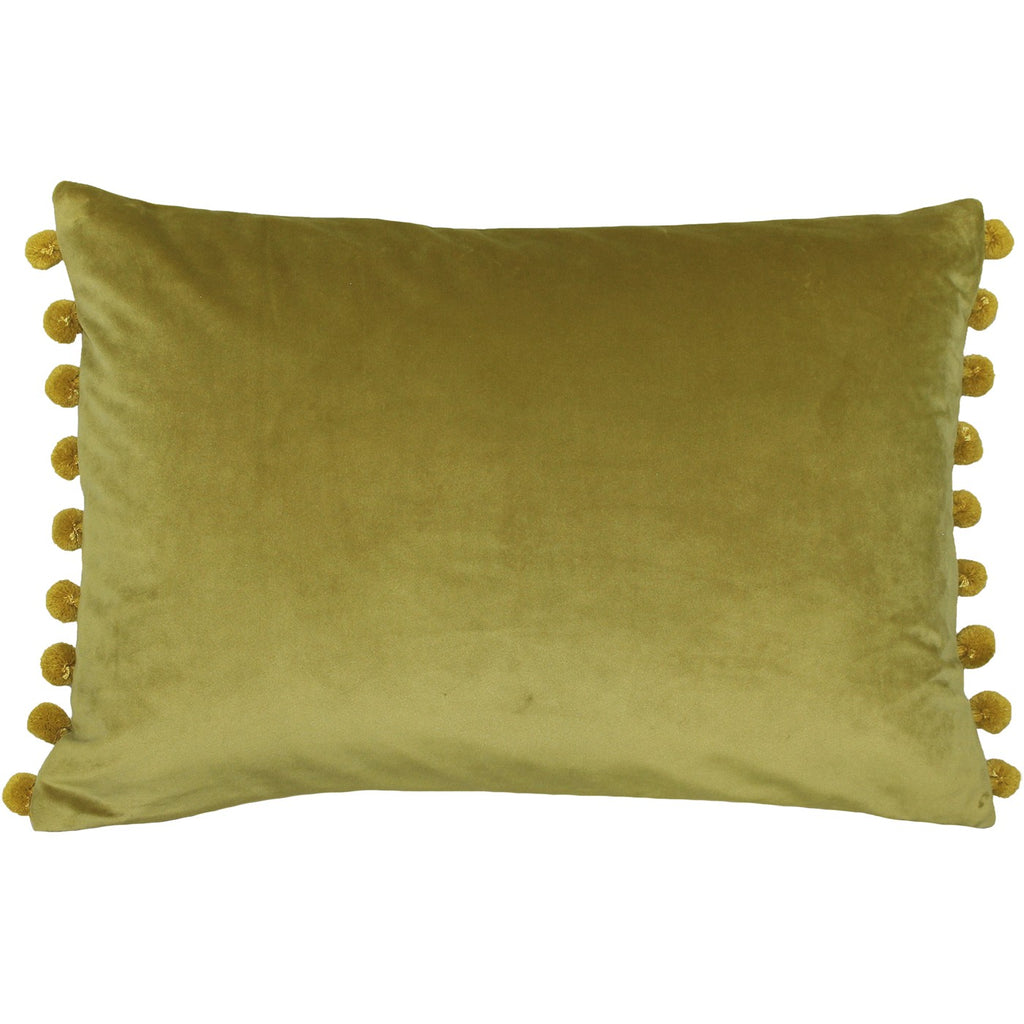 A rectangular cushion with a gold cover and gold pompoms. 