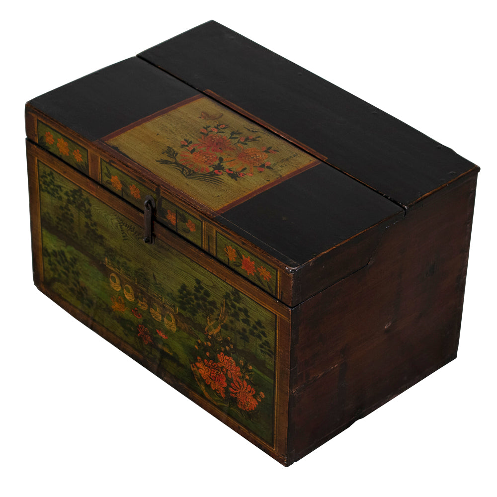 Angled view showing the trunk’s dark-stained wood top and painted floral panel with rich colours and traditional Chinese motifs.

