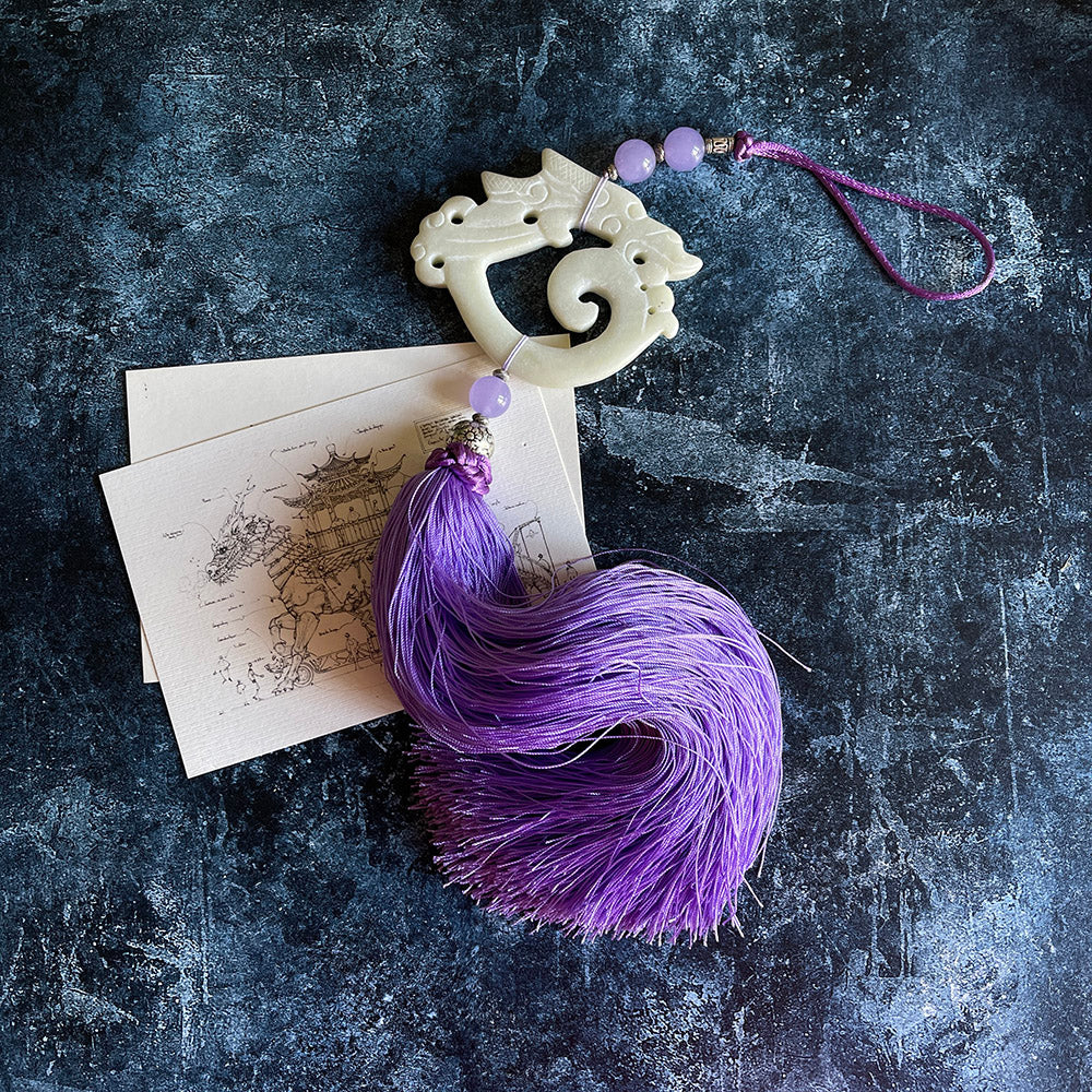 lilac silk tassel decorated with glass beads and hand carved dragon stone
