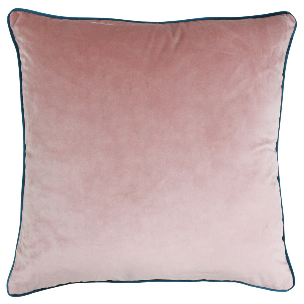A large square cushion with a blush velvet cover and teal piping.