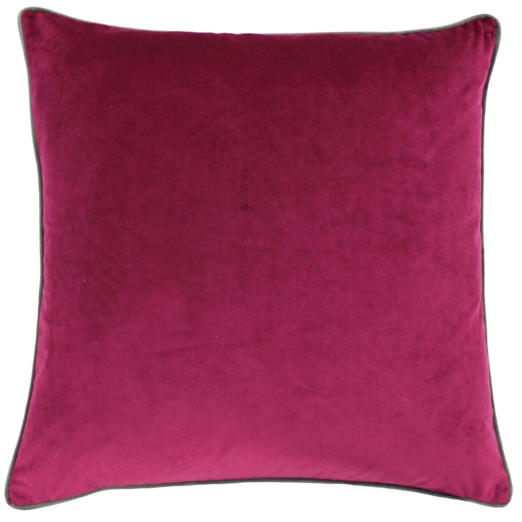 A large square cushion with a cranberry coloured velvet cover with mocha piping. 
