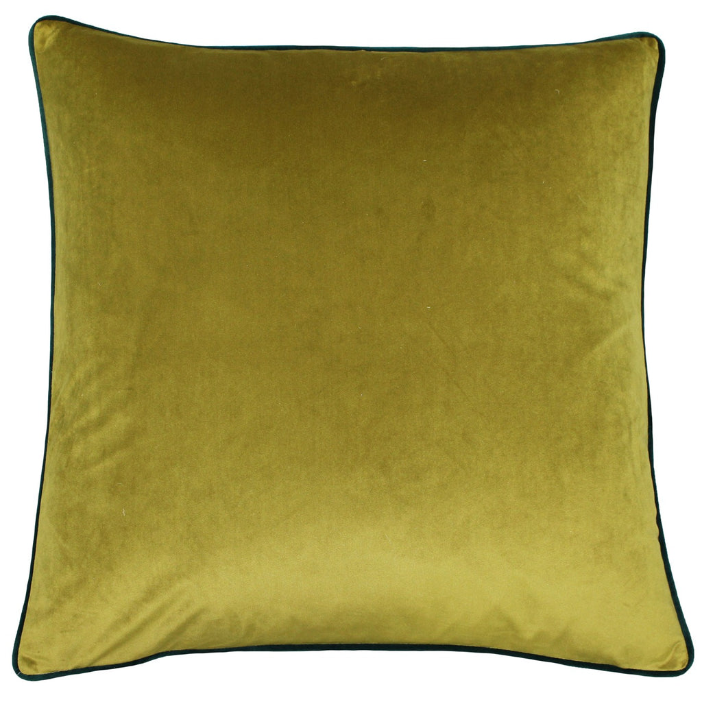 A large square cushion with a yellow-green velvet cover edged with green piping. 