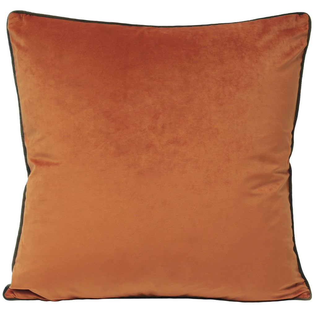 A square cushion with an orange, velvet cover edged with dark grey piping. 