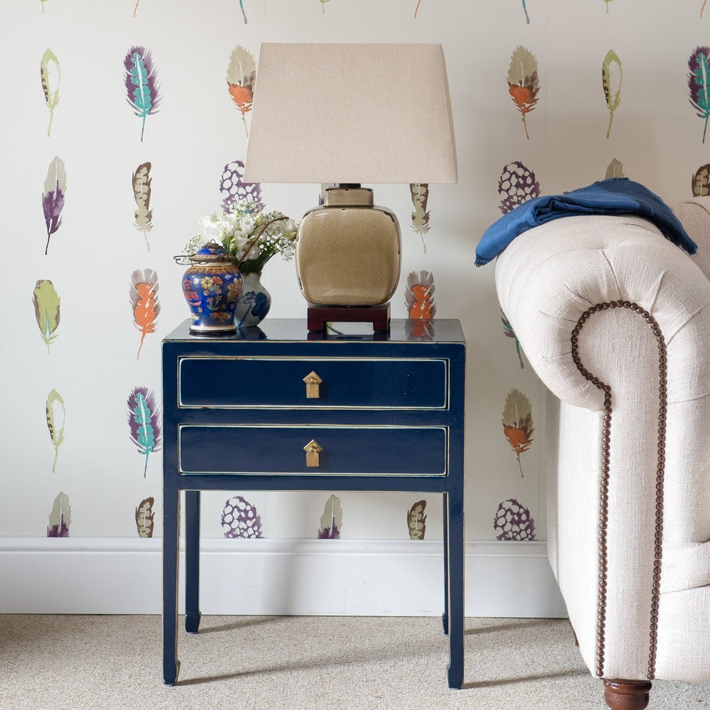 A Mandarin side table with two drawers hand-painted in a dark blue lacquer. It has brass handles and the feet are turned in. 