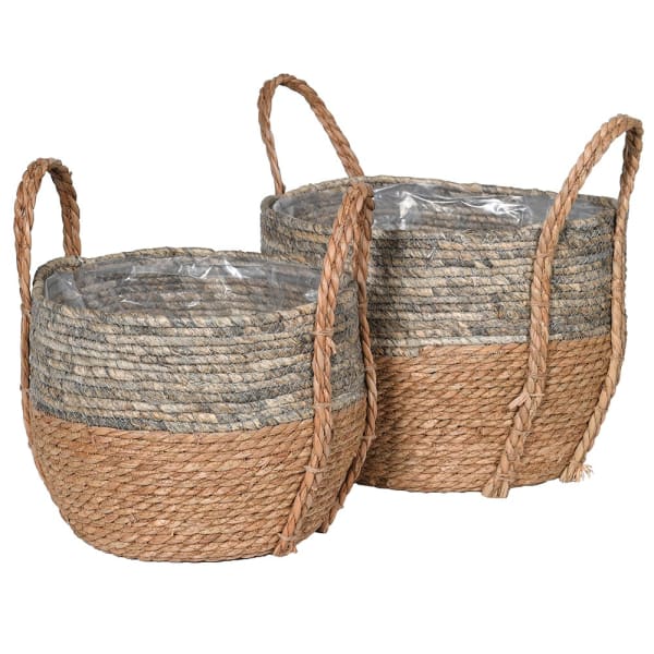 A set of two neutral baskets made of woven straw. 